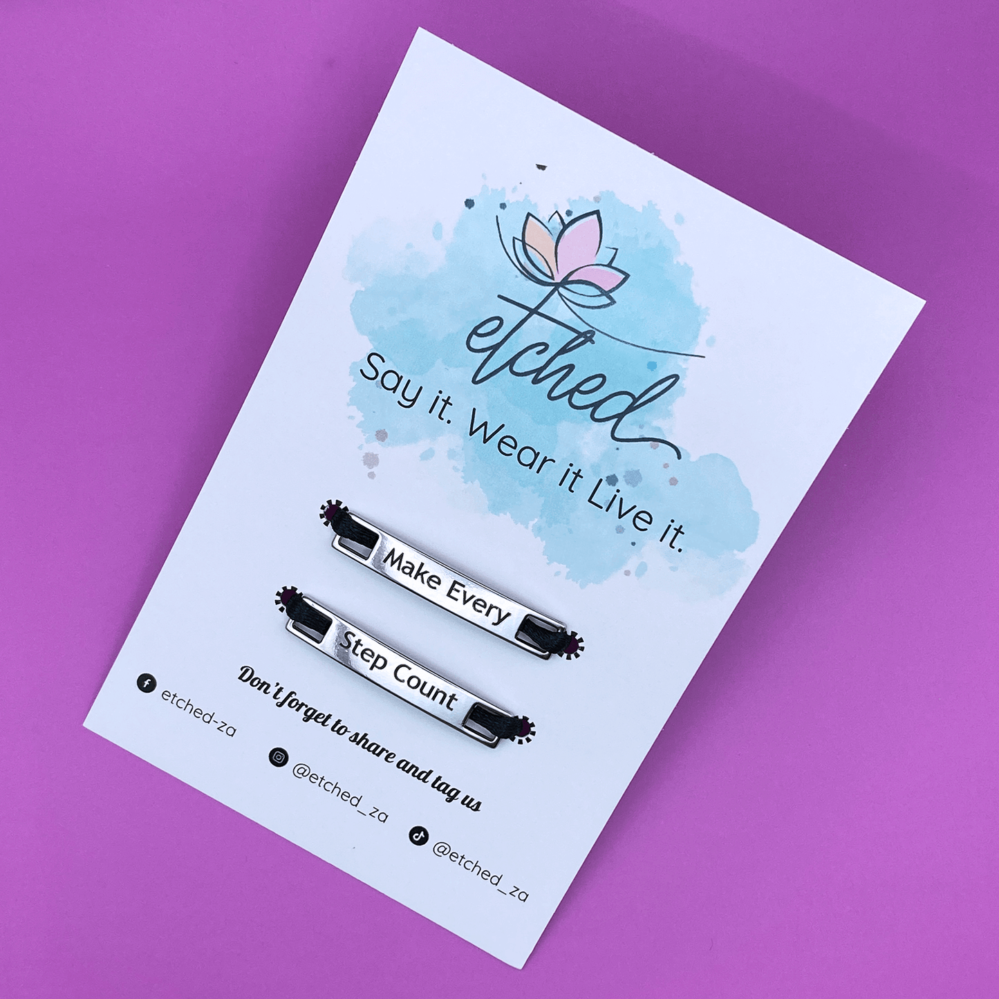 Image of etched product card showing the Make every Step Count shoe tags on a purple background