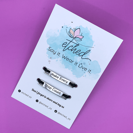 Image of etched product card showing the Make every Step Count shoe tags on a purple background